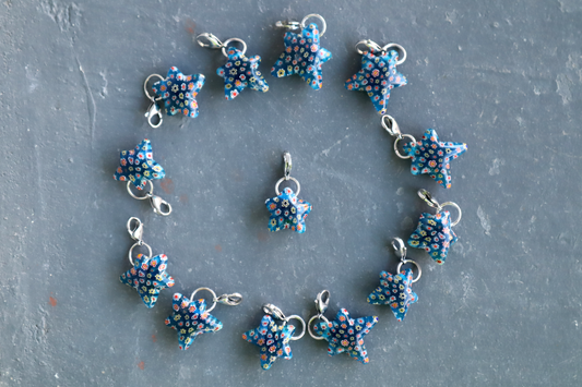 Star-shaped jewelry set on a textured gray surface
