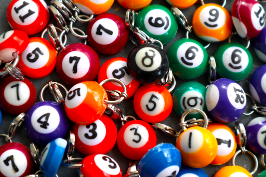 Collection of colorful billiard ball charms with numbers.